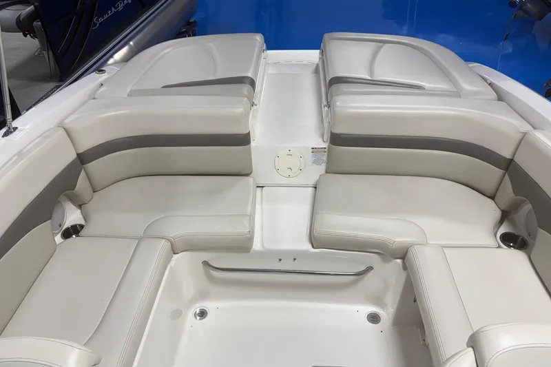 Slide: The Image of 2005 Chaparral 236 SSi boat interior with white and gray seating arrangement. - 5
