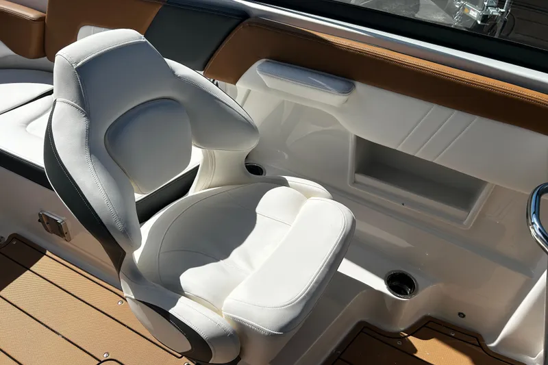 Slide: The Image of Luxury seating in 2026 Chaparral 23 SSi OB boat, featuring white upholstery and modern design. - 17