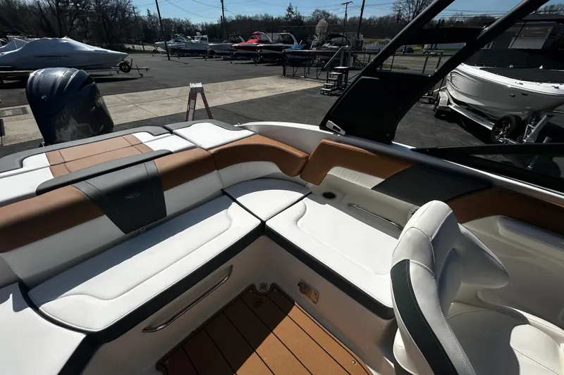 Slide: The Image of Interior view of 2026 Chaparral 23 SSi OB boat, featuring stylish seating and modern design. - 21