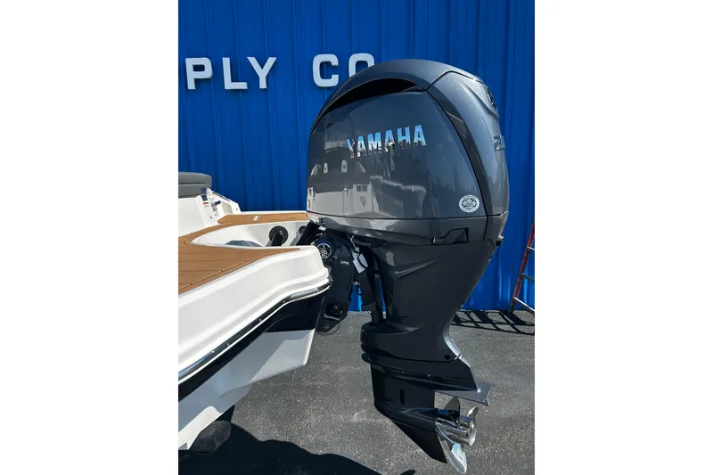 Slide: The Image of 2026 Chaparral 23 SSi OB with Yamaha outboard motor, displayed outdoors. - 27