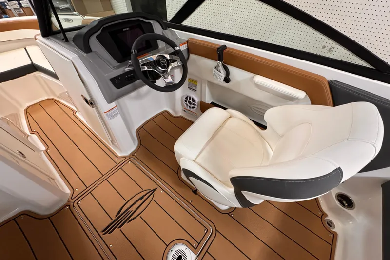 Slide: The Image of 2026 Chaparral 23 SSi OB boat interior at a marine service center. - 7