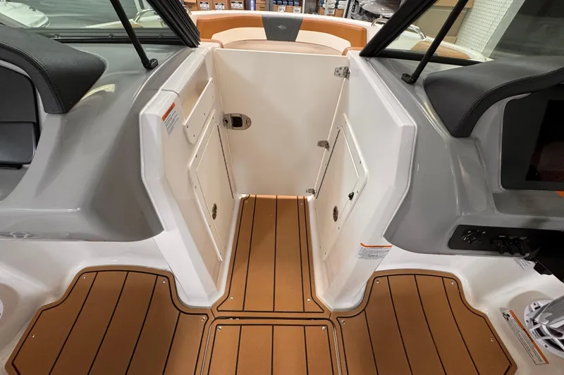Slide: The Image of 2026 Chaparral 23 SSi OB boat interior with tan and gray seating. - 9
