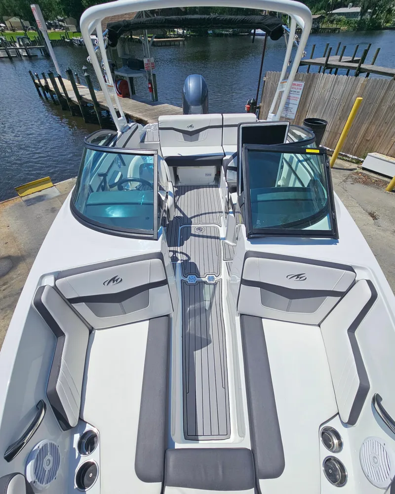 Slide: The Image of 2019 Monterey M-205 boat at dock with open cockpit. - 25