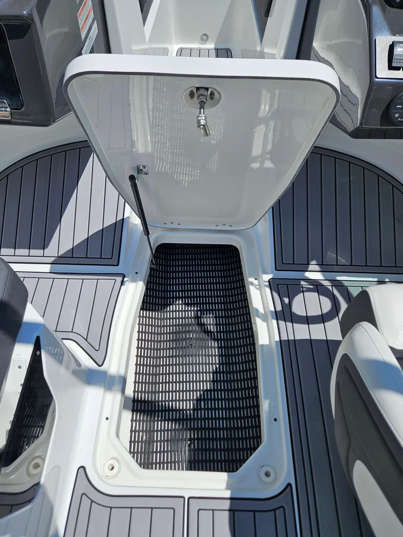 Slide: The Image of Open storage compartment on a 2019 Monterey M-205 boat. - 26