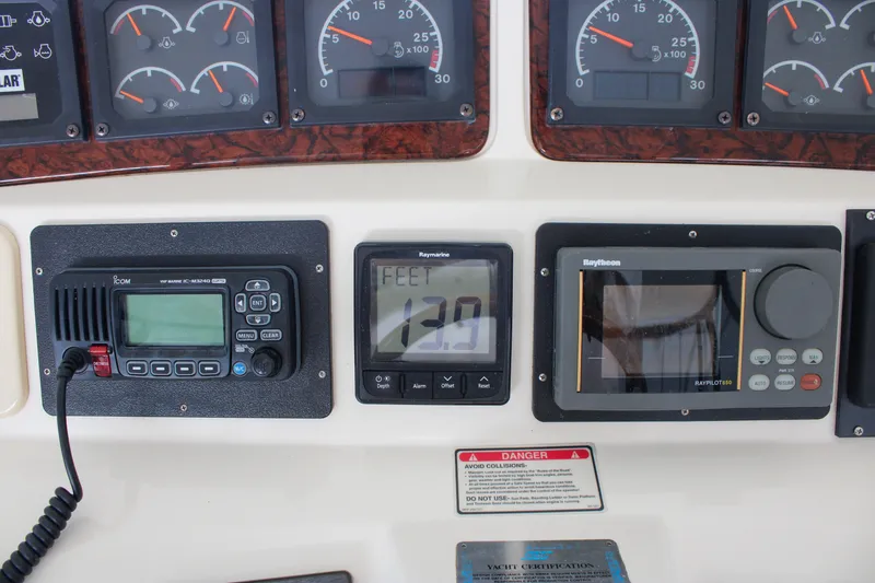 Slide: The Image of 1999 Sea Ray 480 Sedan Bridge dashboard with navigation and communication instruments. - 24