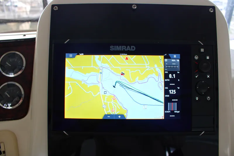 Slide: The Image of Simrad navigation display on 1999 Sea Ray 480 Sedan Bridge yacht dashboard. - 25