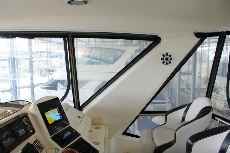 Slide: The Image of Interior view of 1999 Sea Ray 480 Sedan Bridge yacht cockpit with navigation equipment. - 28