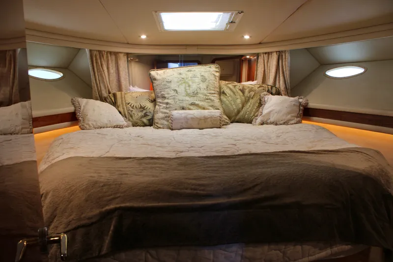 Slide: The Image of Luxurious bedroom interior of 1999 Sea Ray 480 Sedan Bridge yacht. - 33