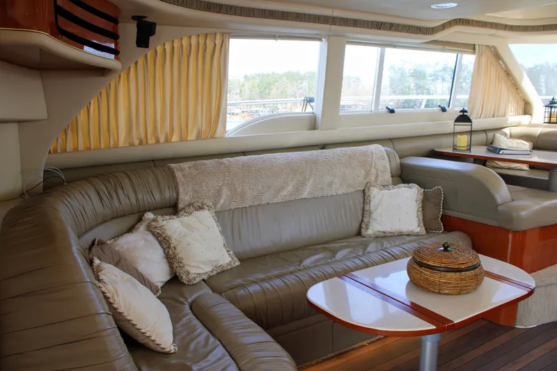Slide: The Image of Luxurious interior of a 1999 Sea Ray 480 Sedan Bridge yacht with plush seating. - 44