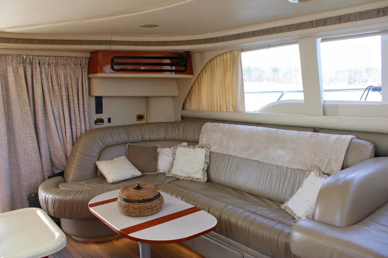 Slide: The Image of Luxurious interior of 1999 Sea Ray 480 Sedan Bridge yacht with plush seating and elegant decor. - 47