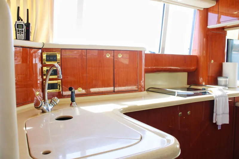 Slide: The Image of Luxurious kitchen interior of 1999 Sea Ray 480 Sedan Bridge yacht. - 52