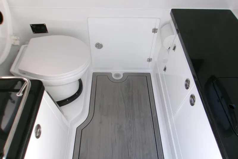 Slide: The Image of 2026 Monterey Elite 30 OB boat bathroom with modern fixtures and sleek design. - 11