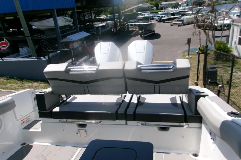 Slide: The Image of 2026 Monterey Elite 30 OB boat with sleek seating and dual outboard engines. - 16