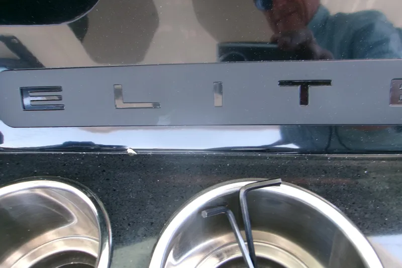 Slide: The Image of Close-up of 2026 Monterey Elite 30 OB boat nameplate and cup holders. - 18