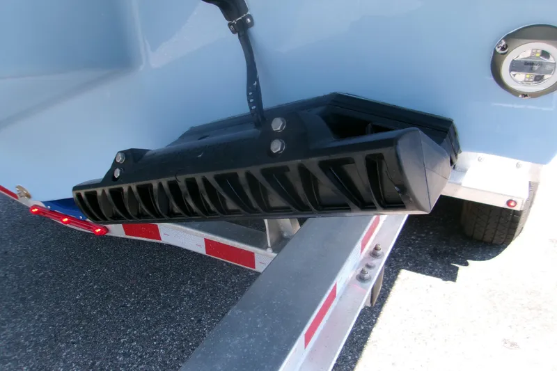 Slide: The Image of 2026 Monterey Elite 30 OB boat trailer detail with black component and LED light. - 19