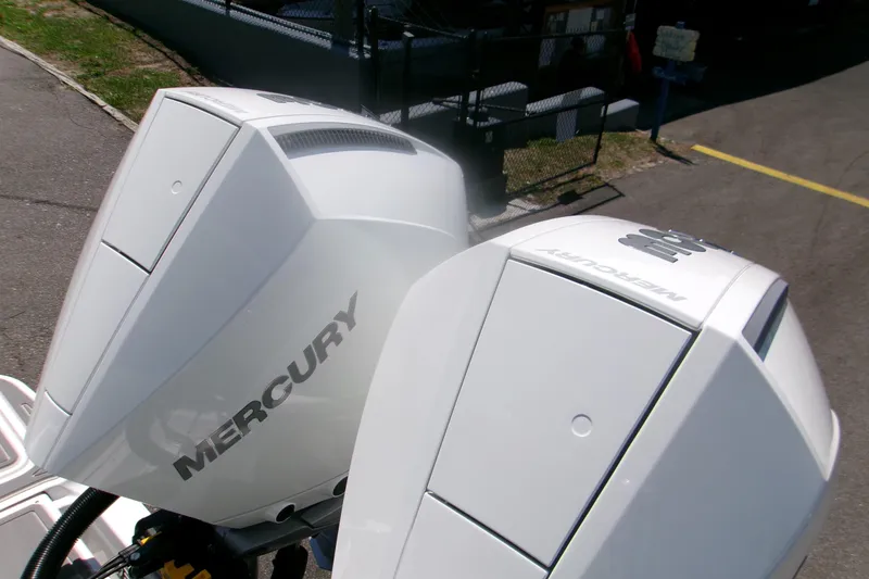 Slide: The Image of Twin Mercury outboard engines on a 2026 Monterey Elite 30 OB boat. - 6
