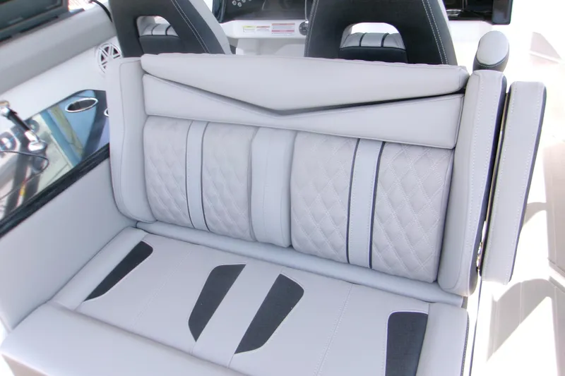 Slide: The Image of Luxurious seating on the 2026 Monterey Elite 30 OB boat, featuring elegant quilted upholstery. - 7