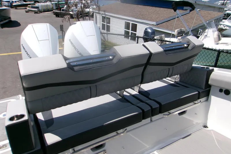 Slide: The Image of 2026 Monterey Elite 30 OB boat with dual Mercury outboard engines and luxurious seating. - 8