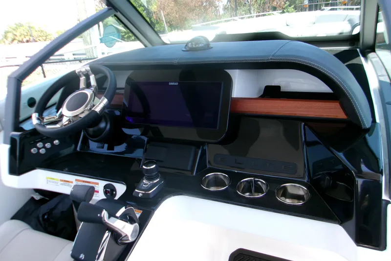 Slide: The Image of 2026 Monterey Elite 30 OB dashboard with modern controls and sleek design. - 9