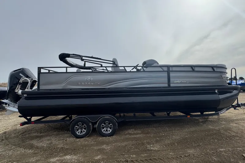 The Image of 2024 Regency 250 DL3 pontoon boat on trailer, side view. - 0