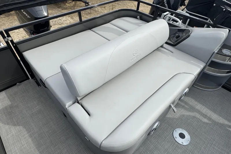 Slide: The Image of 2024 Regency 250 DL3 boat interior with gray cushioned seating and modern design. - 10