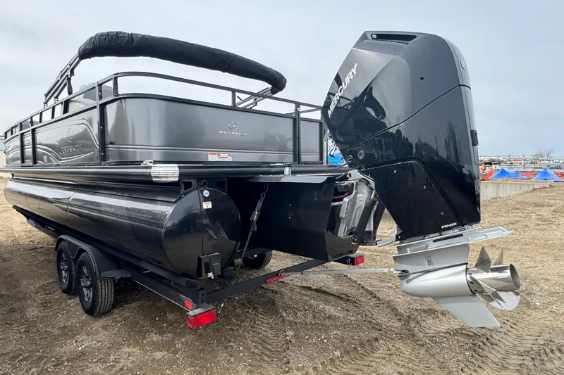 Slide: The Image of 2024 Regency 250 DL3 pontoon boat with Mercury outboard motor on a trailer. - 4