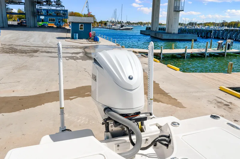 Slide: The Image of 2023 Everglades 243 Center Console boat at marina with Yamaha outboard engine. - 28