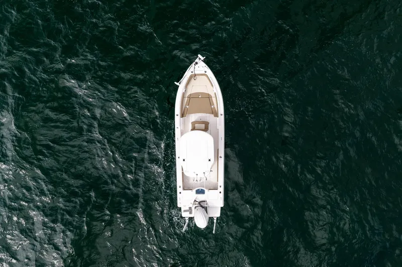 Slide: The Image of Overhead view of 2023 Everglades 243 Center Console boat on dark water. - 36