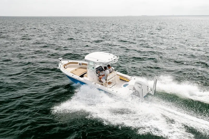 Slide: The Image of 2023 Everglades 243 Center Console boat cruising on open water. - 70