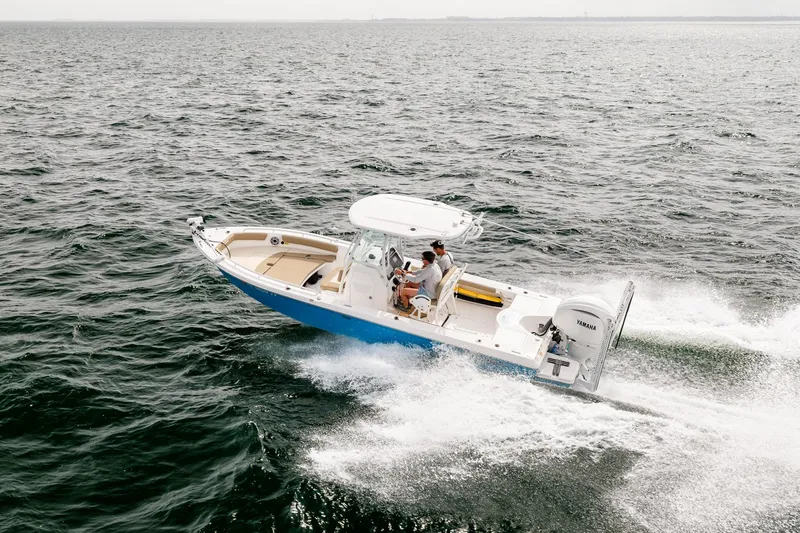 Slide: The Image of 2023 Everglades 243 Center Console boat cruising on open water. - 71