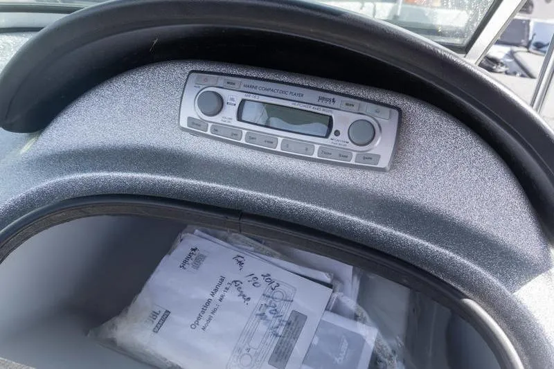 Slide: The Image of Dashboard of a 2012 Triton 190 SE boat with a marine compact disc player. - 10