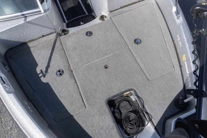 Slide: The Image of 2012 Triton 190 SE boat deck with Minn Kota trolling motor and carpeted surface. - 12