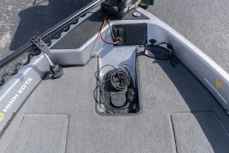Slide: The Image of 2012 Triton 190 SE boat deck with Minn Kota trolling motor and coiled cables. - 13