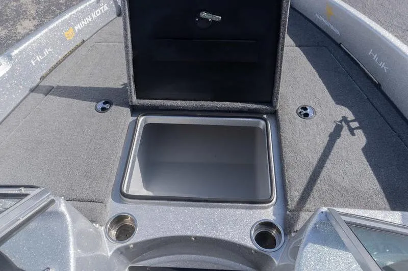 Slide: The Image of 2012 Triton 190 SE boat deck with open storage compartment and cup holders. - 15