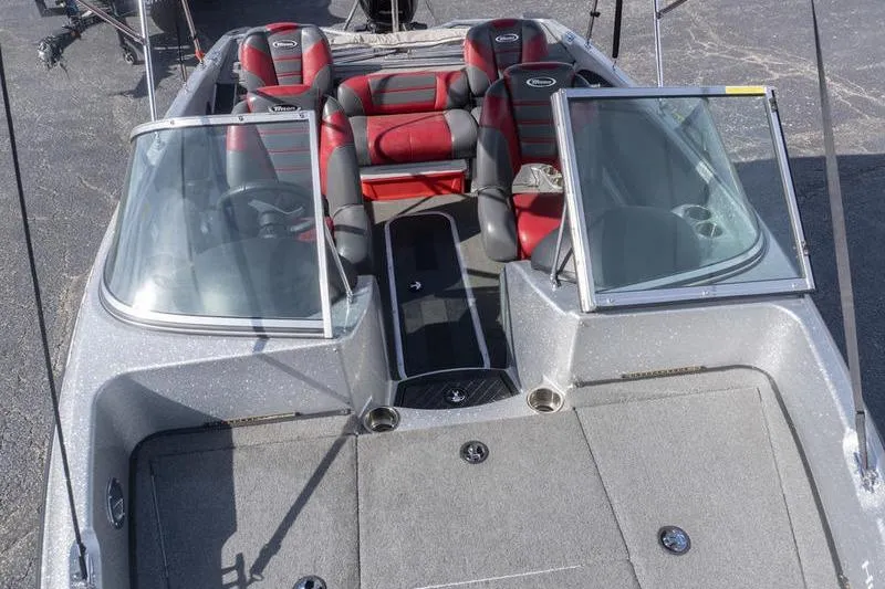 Slide: The Image of 2012 Triton 190 SE boat interior with red and black seating, open windshield. - 17