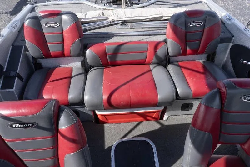 Slide: The Image of Red and gray seating in a 2012 Triton 190 SE boat interior. - 19