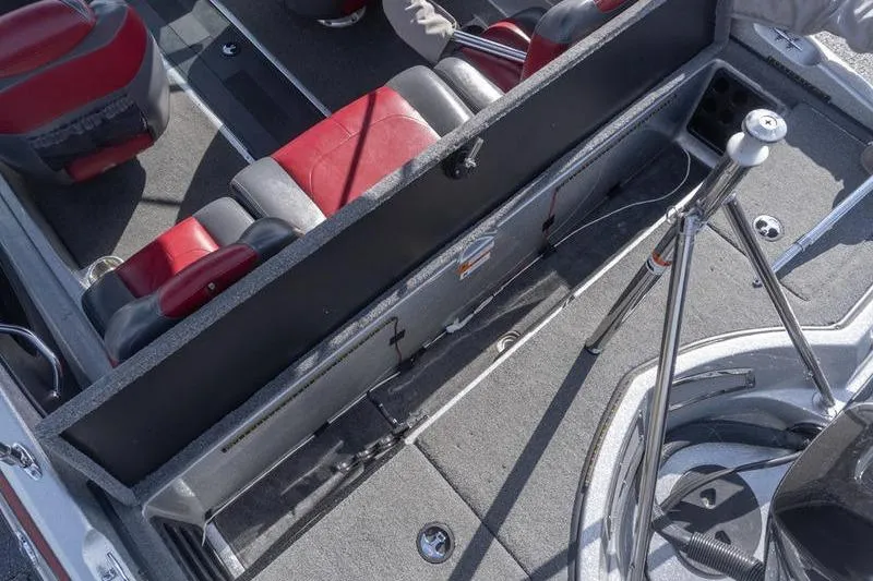 Slide: The Image of Interior of a 2012 Triton 190 SE boat with red and black seating. - 20