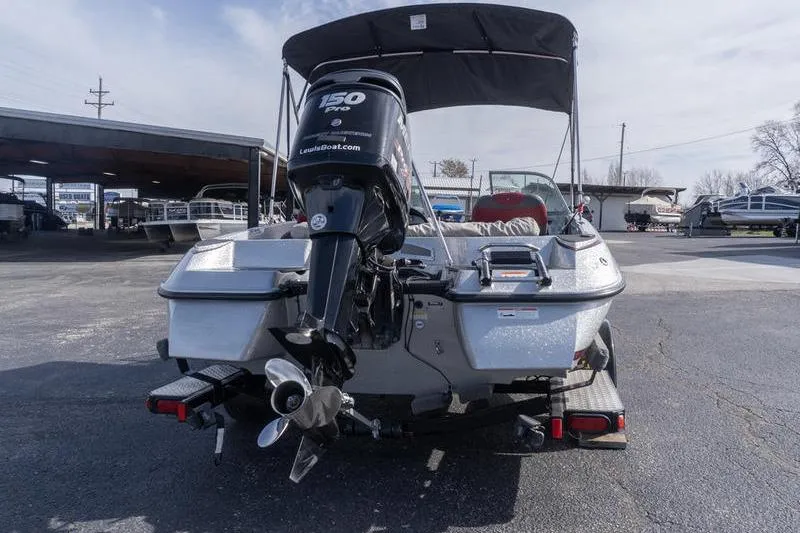 Slide: The Image of 2012 Triton 190 SE boat with 150 Pro motor, parked outdoors. - 4
