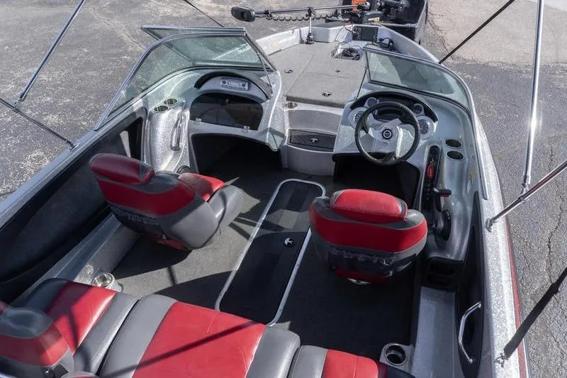 Slide: The Image of Interior of 2012 Triton 190 SE boat with red and gray seating. - 6