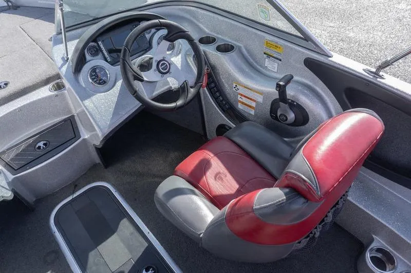Slide: The Image of Interior of a 2012 Triton 190 SE boat with red and gray seating. - 7