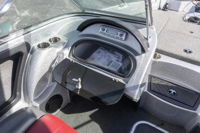 Slide: The Image of Interior of a 2012 Triton 190 SE boat showing dashboard and storage compartment. - 9