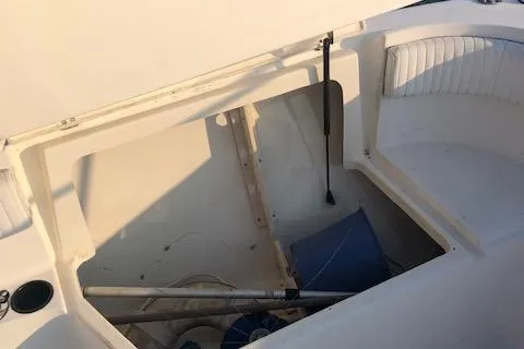 Slide: The Image of Storage compartment of a 1999 Boston Whaler Outrage 26 boat. - 11