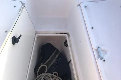 Slide: The Image of Storage compartment in 1999 Boston Whaler Outrage 26 boat. - 13