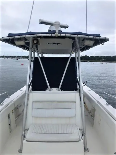 Slide: The Image of 1999 Boston Whaler Outrage 26 on calm waters. - 14