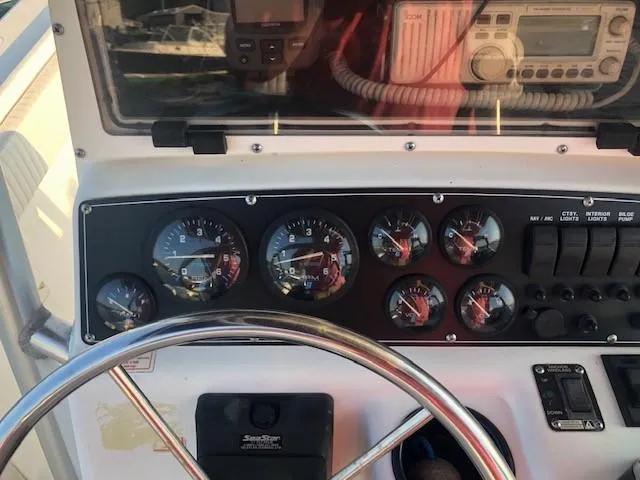 Slide: The Image of Dashboard of a 1999 Boston Whaler Outrage 26 boat. - 17
