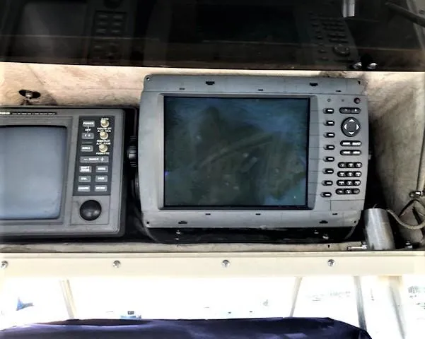Slide: The Image of Navigation systems on a 1999 Boston Whaler Outrage 26. - 21