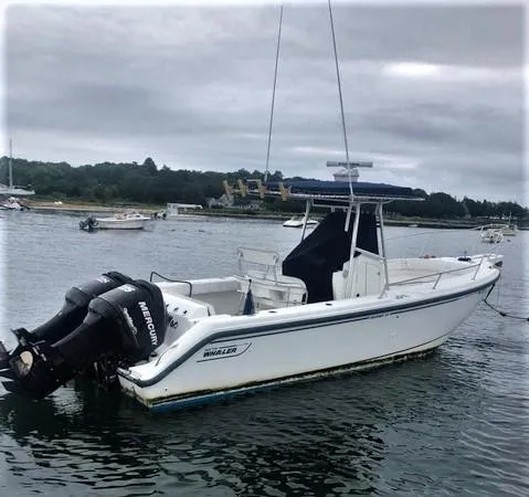 Slide: The Image of 1999 Boston Whaler Outrage 26 boat on calm water. - 5