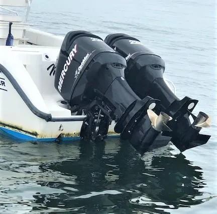 Slide: The Image of 1999 Boston Whaler Outrage 26 with Mercury engines on water. - 6