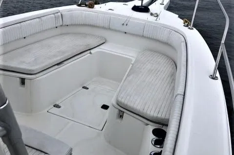Slide: The Image of Interior of a 1999 Boston Whaler Outrage 26 boat with seating area. - 8