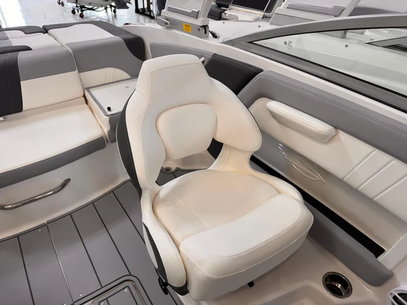 Slide: The Image of 2026 Chaparral 21 SSi OB boat interior with sleek dashboard and seating area. - 14